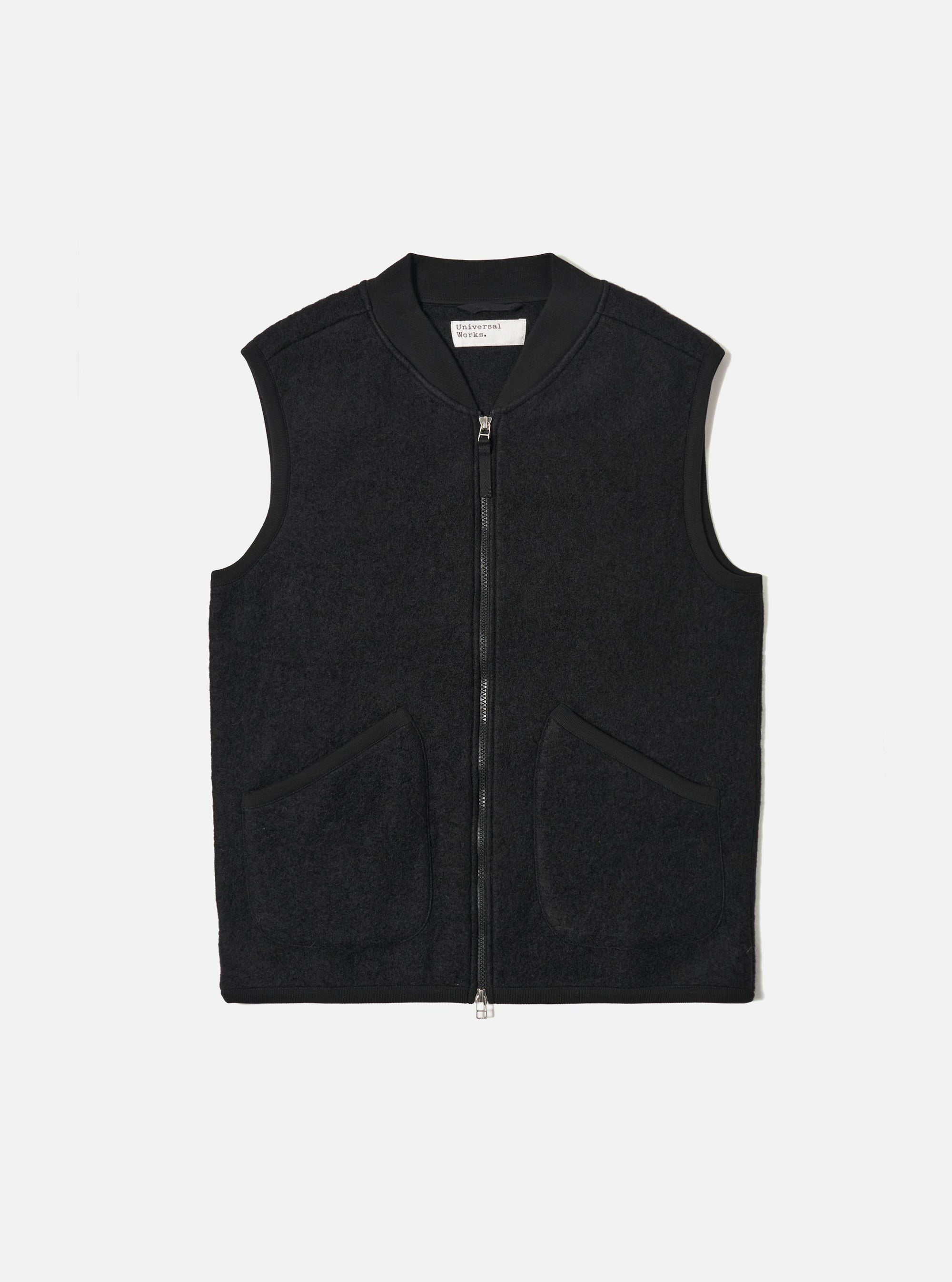 Studio shot of a Black Wool Fleece Zip Waistcoat. The sleeveless jacket is zipped up and laid flat on a white background. The waistcoat has two pockets.