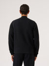 Back view of a model wearing a Black Wool Fleece Zip Waistcoat. The garment is displayed against a plain white background.