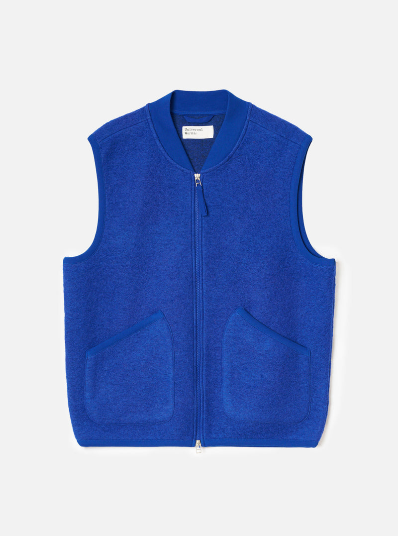 Front product view of the Universal Works Blue Wool Fleece Zip Waistcoat set against a plain white background. The design features a silver two-way front zipper, ribbed collar, jersey binding, and two lower angled patch pockets.