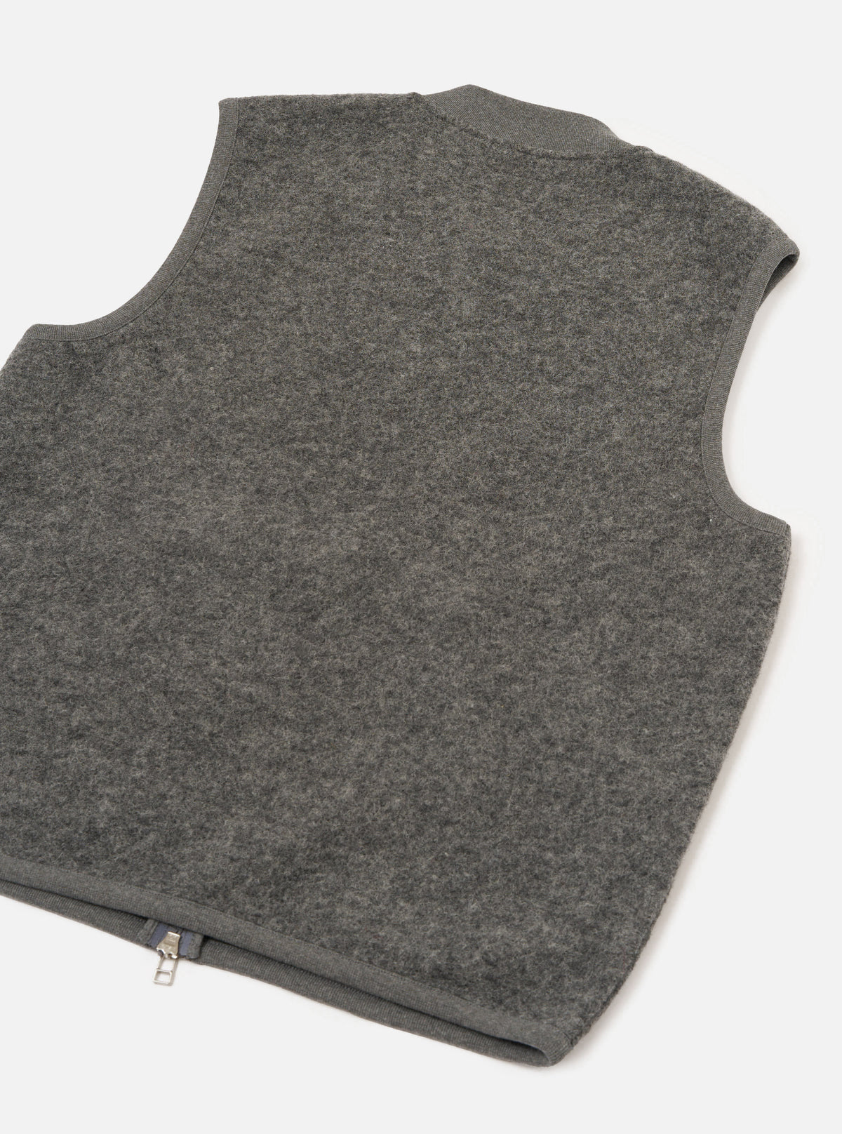 Rear view of the Grey Marl Wool Fleece Zip Waistcoat presented against a plain white background. The back section highlights the soft grey marl wool fleece texture, clean hemline, and simple sleeveless construction.