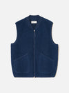 Front view of the Indigo Wool Fleece Zip Waistcoat displayed flat against a plain white background. The deep indigo blue wool fleece fabric, full front zipper, V-neckline, and two lower patch pockets are clearly visible.