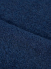 Extreme close-up fabric swatch image showcasing the texture of the Indigo Wool Fleece Zip Waistcoat. The detailed shot highlights the rich indigo blue tone, soft fibers, and cozy tactile feel of the wool fleece material.