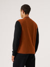 Back view of a man wearing the Rust Wool Fleece Zip Waistcoat over a black long-sleeve shirt. The background is a plain white studio backdrop.