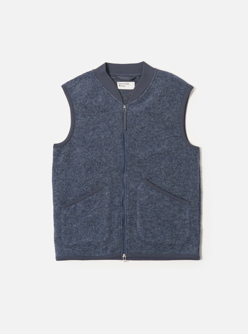 The slate blue wool fleece zip waistcoat is laid flat on a white background. The sleeveless jacket has a full zip and two pockets.