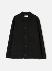 Front view of the Black Wool Fleece Field Jacket displayed flat against a plain white background. Features four front flap pockets, button closure, classic collar, and dark black wool fleece construction.