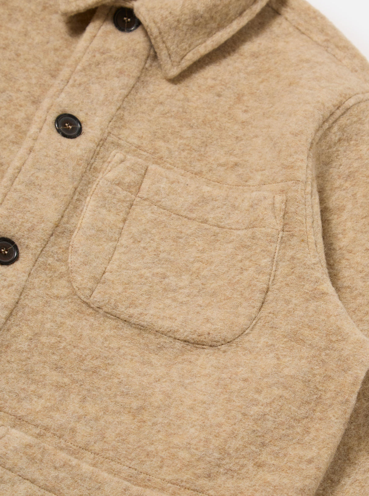 Close-up of the Fawn Wool Fleece Field Jacket, showing the soft texture, button details, and pocket. Shot on a white background.
