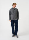 Front view of a model wearing the Grey Marl Wool Fleece Field Jacket in a bright studio setting. The model stands facing forward, displaying how the jacket fits across the shoulders and buttoned torso.