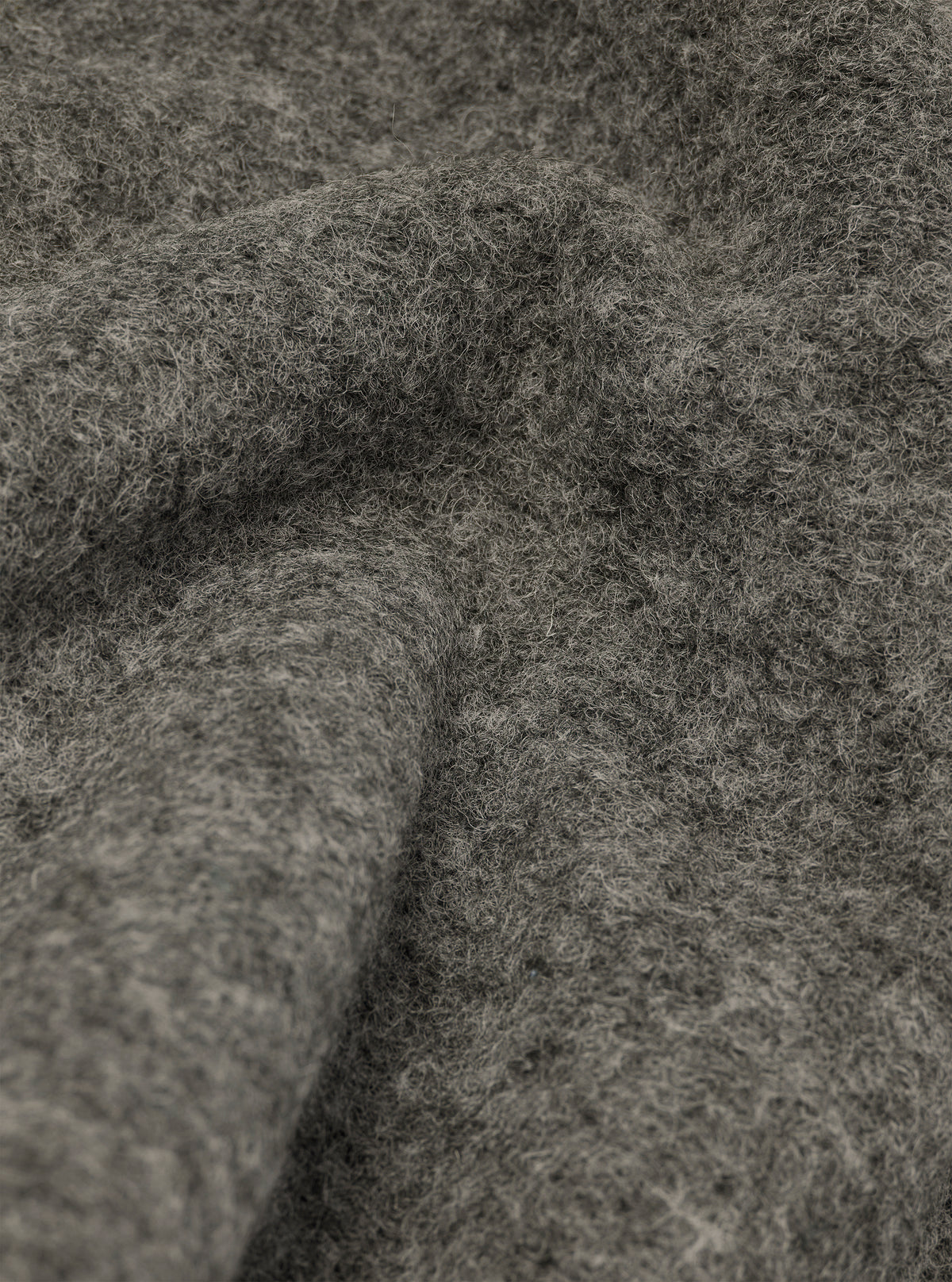 Extreme close-up fabric swatch image showcasing the texture of the Grey Marl Wool Fleece Field Jacket. The detailed shot emphasizes the mixed grey tones, soft fibers, and cozy tactile feel of the material.
