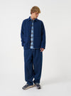 Front view of a model wearing the Indigo Wool Fleece Field Jacket in a light studio setting. The model stands facing forward, showing the comfortable fit, rich indigo shade, and buttoned closure.