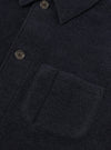 Close-up detail shot of the Navy Wool Fleece Field Jacket against a plain background. Focuses on the dark navy wool fleece fabric texture, front button closures, collar edges, and pocket seams.