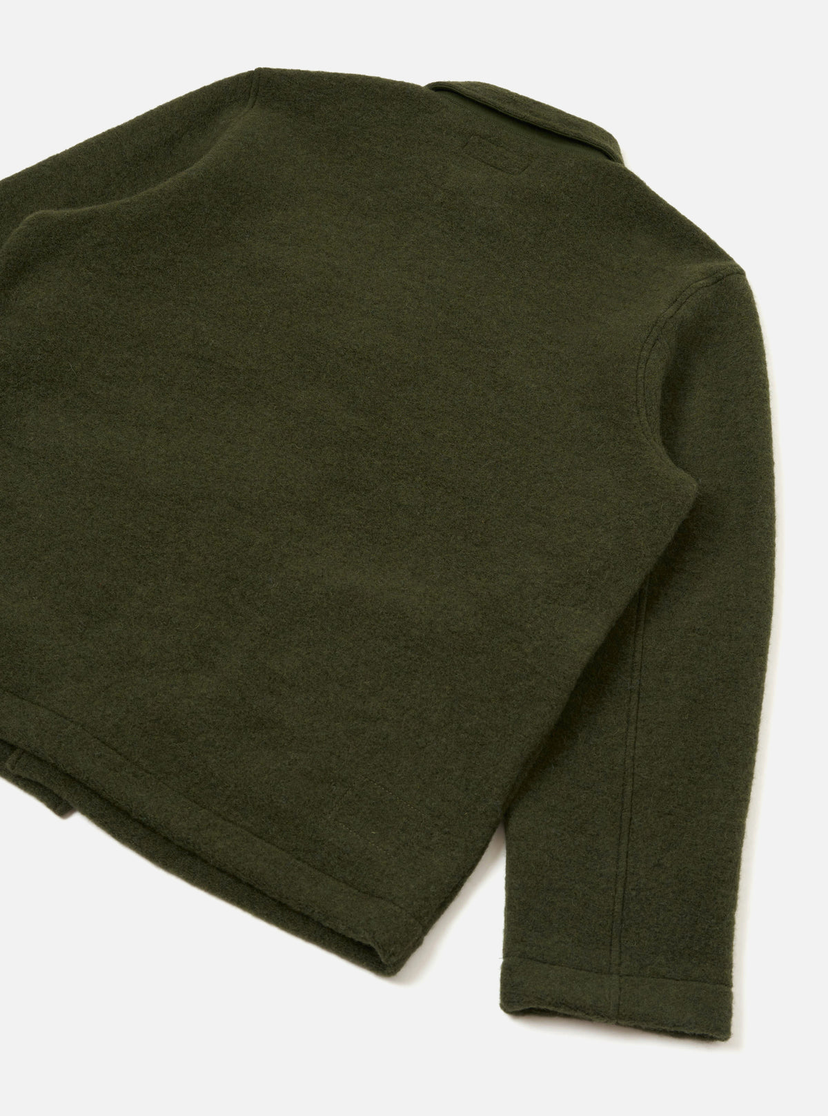 Rear view of the Olive Wool Fleece Field Jacket displayed on a white background. Demonstrates the clean back seam design, straight hemline, and muted olive green wool fleece fabric texture.