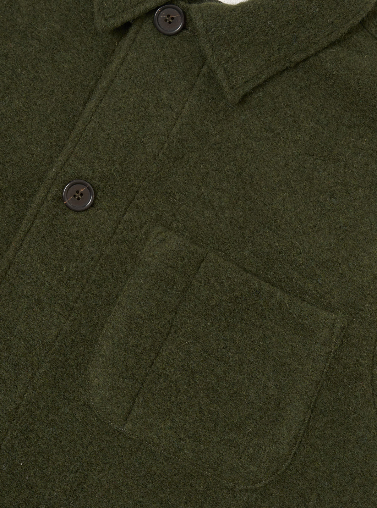 Side view of the Olive Wool Fleece Field Jacket displayed against a plain background. The olive green wool fleece fabric, structured jacket cut, chest pockets, and button placket are clearly visible.