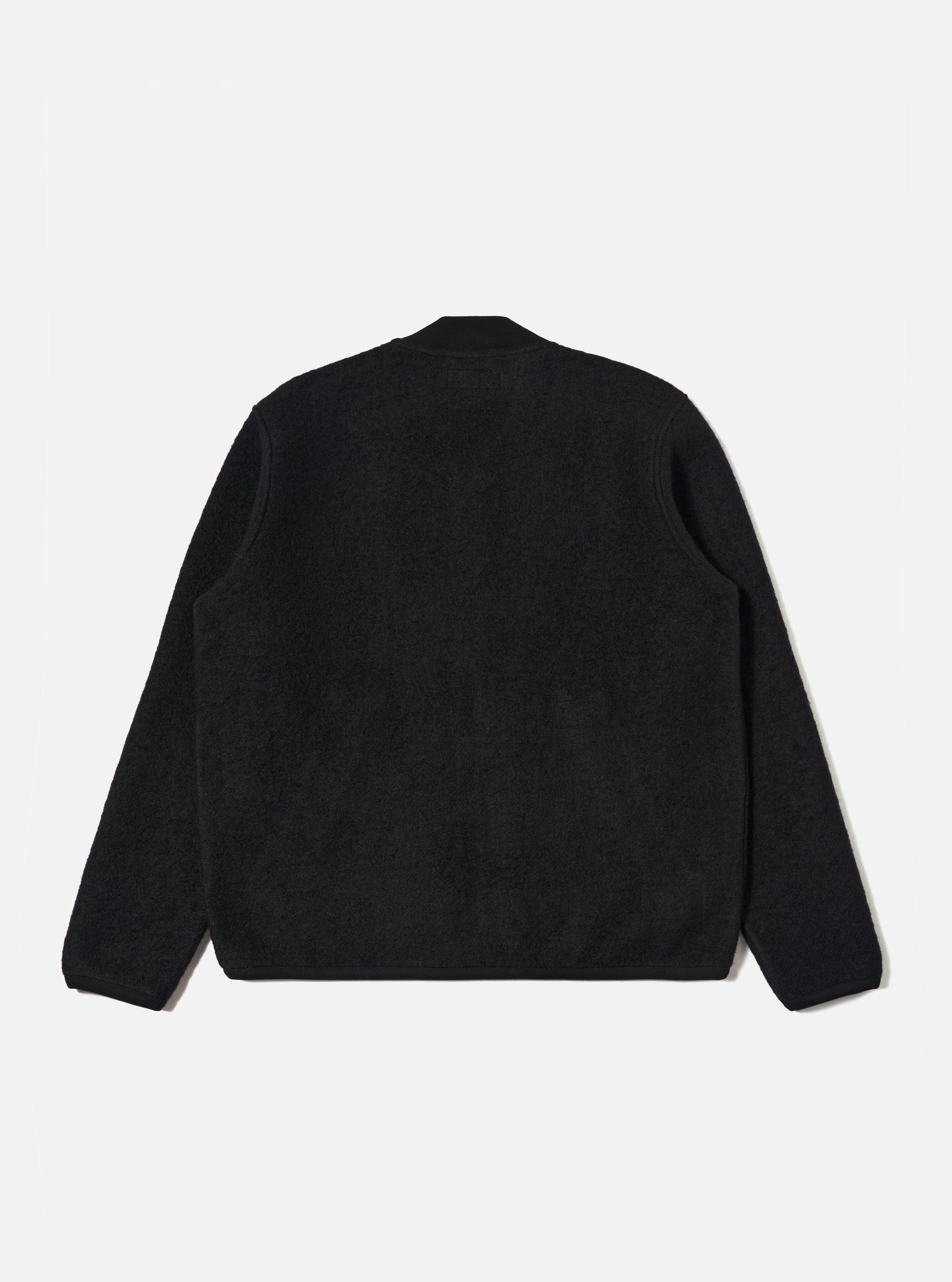 The back of a Black Wool Fleece Zip Bomber jacket, laid flat on a white background. The jacket is a dark, textured wool fleece with a zip front.