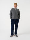 Front view of a model wearing the Grey Marl Wool Fleece Zip Bomber Jacket in a neutral studio backdrop. The model stands facing forward, showing the grey heather fleece pattern, front zip closure, and classic fit.