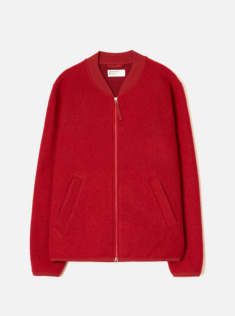 The Scarlet Wool Fleece Zip Bomber Jacket laid flat on a white studio backdrop. Features scarlet boiled wool fleece, a tonal satin ribbed bomber collar, front zip with red leather pull tab, two side welt pockets, ribbed cuffs, and ribbed hem.