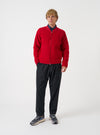 Front view of a model wearing the Scarlet Wool Fleece Zip Bomber Jacket against a studio background. The model faces forward, highlighting the bright red wool fleece fabric, full front zipper, collar, and rib cuffs.