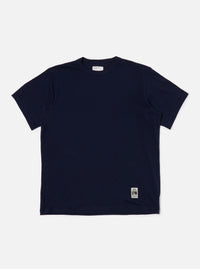 The Navy Single Jersey Core Tee is displayed on a white background. The tee is a dark navy color and appears to be made of a soft, single jersey material. 