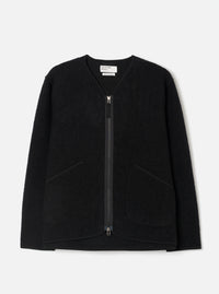 Front view of the Black Wool Fleece Zip Liner Jacket displayed flat against a plain white background. The deep black wool fleece fabric, full-length front zipper, collarless neck, and patch pockets are clearly highlighted.