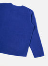 Rear view of the Blue Wool Fleece Zip Liner Jacket presented flat against a white background. The image highlights the soft blue wool fleece texture, clean back panel, stitched hemline, and simple jacket silhouette.
