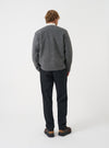 Back view of a model wearing the Grey Marl Wool Fleece Zip Liner Jacket against a neutral background. Highlights the fit across the shoulders and back, detailing the heathered grey wool fleece texture.