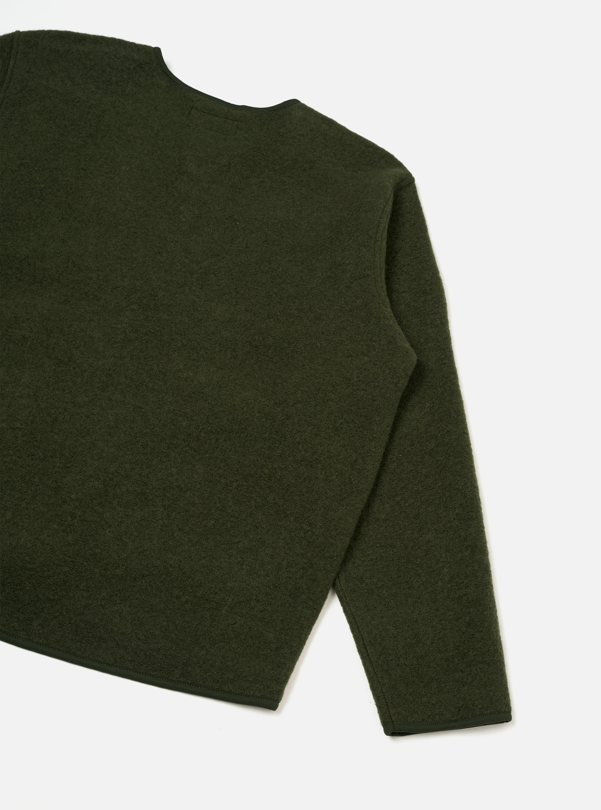 Rear view of the Olive Wool Fleece Zip Liner Jacket presented against a clean white background. Highlights the full back construction, simple hem, and soft olive green wool fleece texture across the upper and lower back panel.