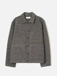 Grey marl wool fleece uniform jacket laid flat on a light grey seamless backdrop. Spread collar with a Universal Works woven label at the neckline. Five dark buttons run down the centre front placket. One chest patch pocket and two large lower patch pockets. Full-length sleeves with plain cuffs. Textured boiled wool fleece fabric throughout.