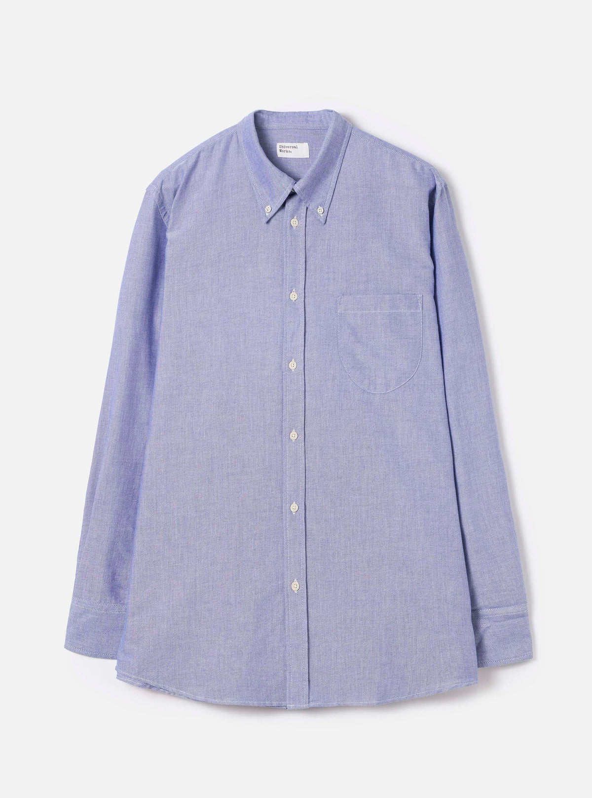 Front view of the Blue Oxford Daybrook Shirt displayed flat against a plain white background. The long-sleeve cotton shirt features a button-down collar, full button placket, chest pocket, and classic tailored hemline.