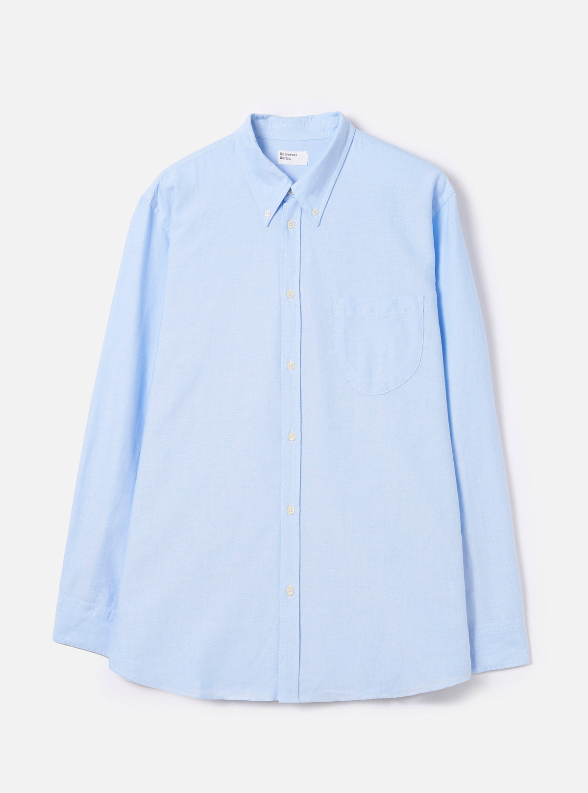 Front view of the Sky Blue Oxford Daybrook Shirt displayed flat against a plain white background. Features a classic button-down collar, chest pocket, full button placket, and light sky blue organic cotton oxford structure.