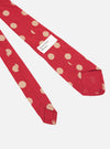 Close-up of a Red Bold Dot Print Rayon Tie on a white background. The tie features large tan dots and a brand label.