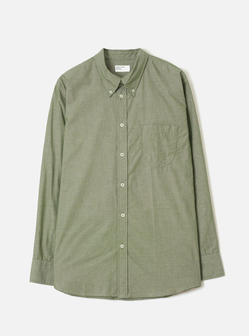 Front view of the Olive Prince Chambray Daybrook Shirt laid flat on a light grey backdrop. Features a spread collar, button-front placket, a single patch pocket on the left chest, and long sleeves with buttoned cuffs. No model or mannequin present.