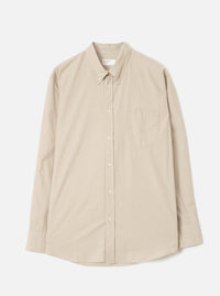 Front view of the Sand Prince Chambray Daybrook Shirt laid flat on a plain light grey studio backdrop. Prominent features include a pointed collar, a full-length button placket, a single chest patch pocket, and long sleeves with button cuffs.