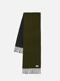 Front view of the Green/Black Double Sided Scarf laid flat on a neutral background. The image highlights the two-tone color combination of dark green and black, showing the knit texture, fringe edge detailing, and woven finish.