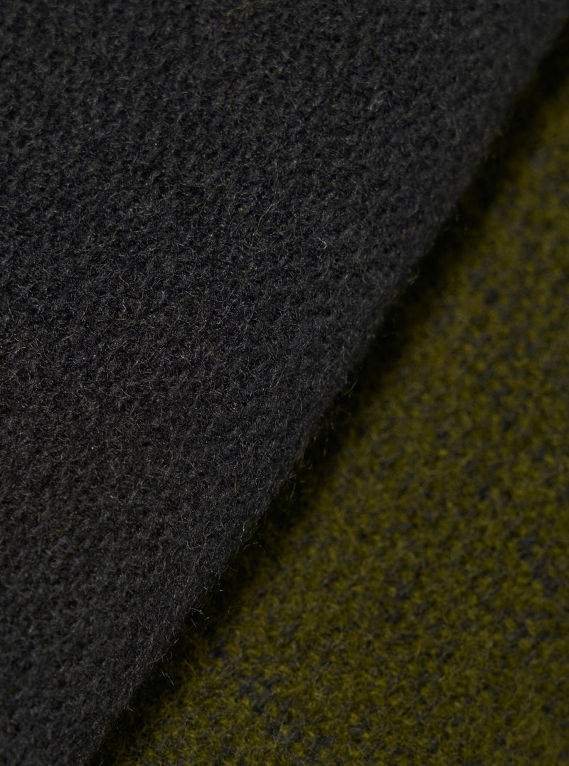 Close-up fabric swatch image showcasing the material of the Green/Black Double Sided Scarf. The detailed shot highlights the rich green and black tones, soft knit texture, and double-sided woven construction of the accessory.