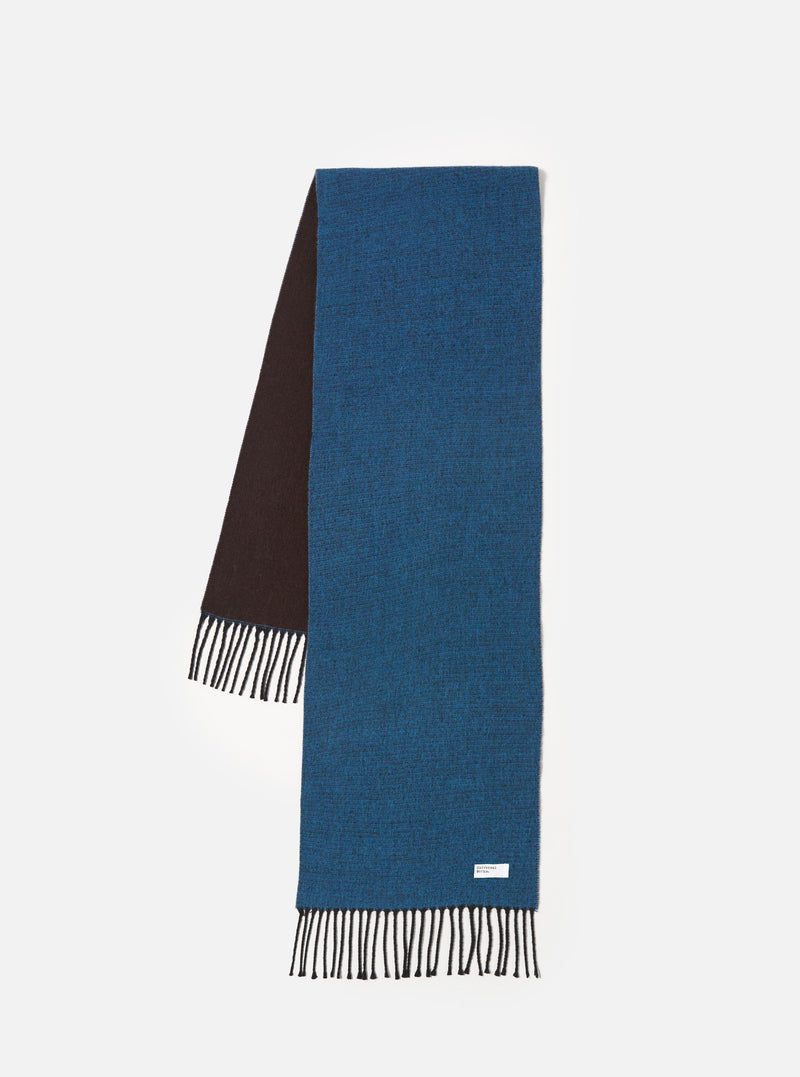Front view of the Light Blue/Brown Double Sided Scarf laid flat against a plain white background. The image displays the dual-sided design featuring light blue on one side and warm brown on the other, complete with fringed ends.