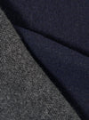 Close-up fabric swatch shot highlighting the texture of the Navy/Mid Grey Double Sided Scarf. The detailed image captures the fine weave of the navy blue and mid-grey threads, showcasing the soft quality of the scarf fabric.
