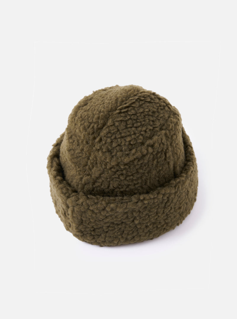 Close-up of the cableami® Olive Toque Boa Cap on a white background. The hat is a soft, olive green color with a textured, boa-like material.