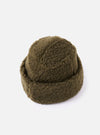 Close-up of the cableami® Olive Toque Boa Cap on a white background. The hat is a soft, olive green color with a textured, boa-like material.