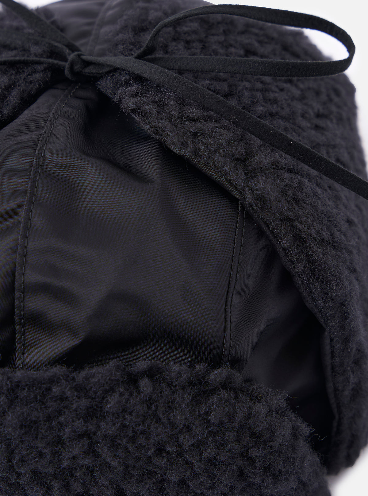 Close-up of the cableami® Black Military Nylon Twill Boa Aviator hat, showing the black nylon and boa textures. The hat is on a white background.