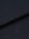 Extreme close-up fabric swatch image showing the fine texture of the Navy Twill Bakers Chore Jacket. Details the diagonal weave pattern, durable structure, and deep navy color of the cotton twill fabric.