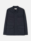 Front view of the Navy Twill MW Fatigue Jacket displayed against a white background. Shows four front flap pockets, hidden button placket, folded collar, and structured military-inspired utility style in navy.