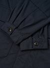 Internal view of the Navy Twill MW Fatigue Jacket against a white background. Shows the unlined cotton twill interior, waist drawstring adjustment channels, and internal pocket detail clearly.