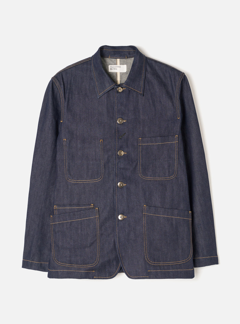 Front view of the Indigo 13oz Selvedge Denim Bakers Chore Jacket against a plain white background. Shows the button front, classic collar, patch chest pocket, and two lower utility pockets.