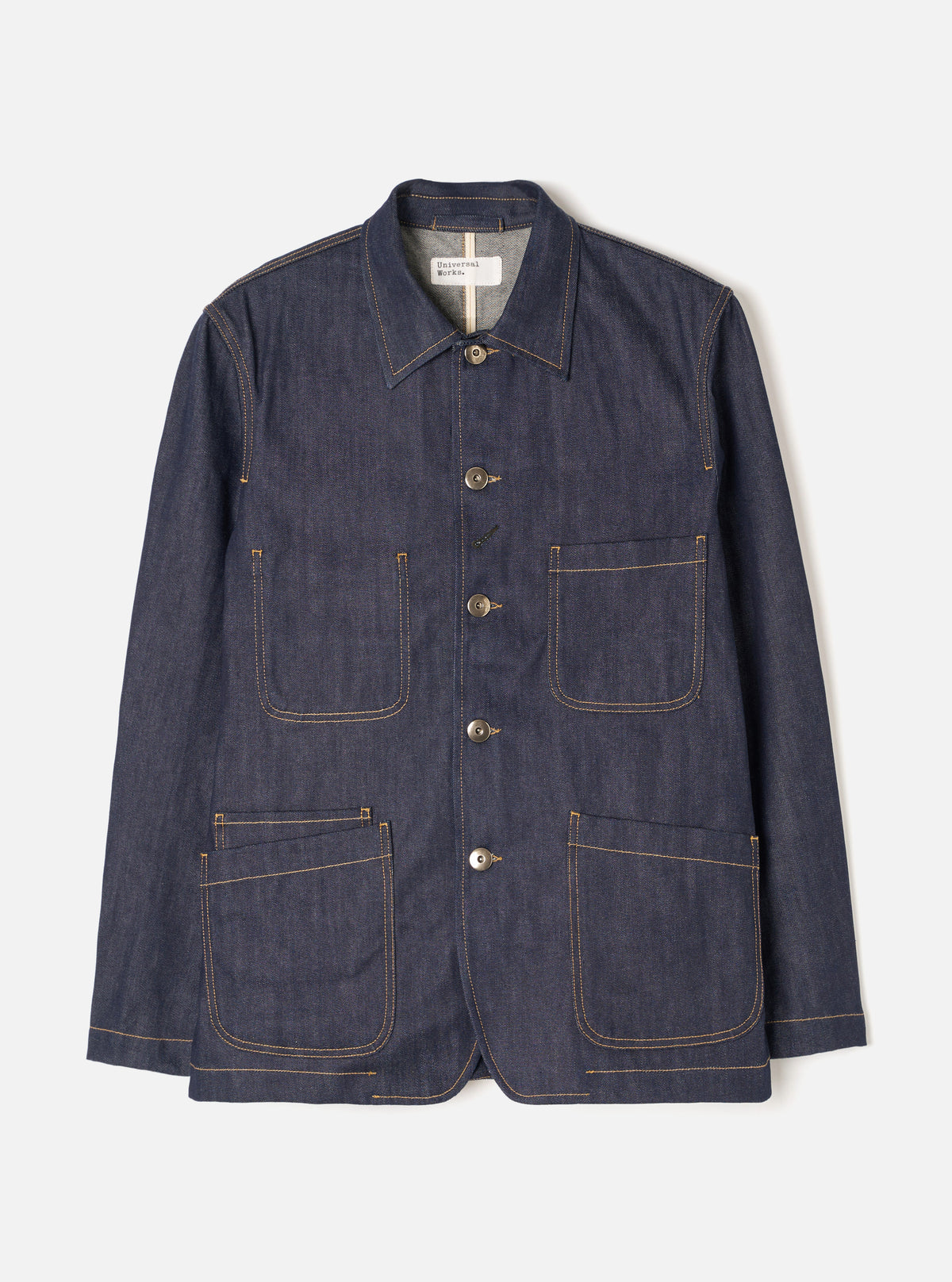 Front view of the Indigo 13oz Selvedge Denim Bakers Chore Jacket against a plain white background. Shows the button front, classic collar, patch chest pocket, and two lower utility pockets.