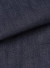 Close-up fabric swatch image of the Indigo 13oz Selvedge Denim Bakers Chore Jacket against a plain studio backdrop, demonstrating the diagonal twill texture and rich deep indigo coloring.
