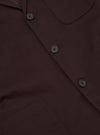 The Brown Twill Three Button Jacket is shown from the back, displayed flat against a plain white background. The image highlights the jacket's clean construction, featuring a central seam and a single vent at the hem.