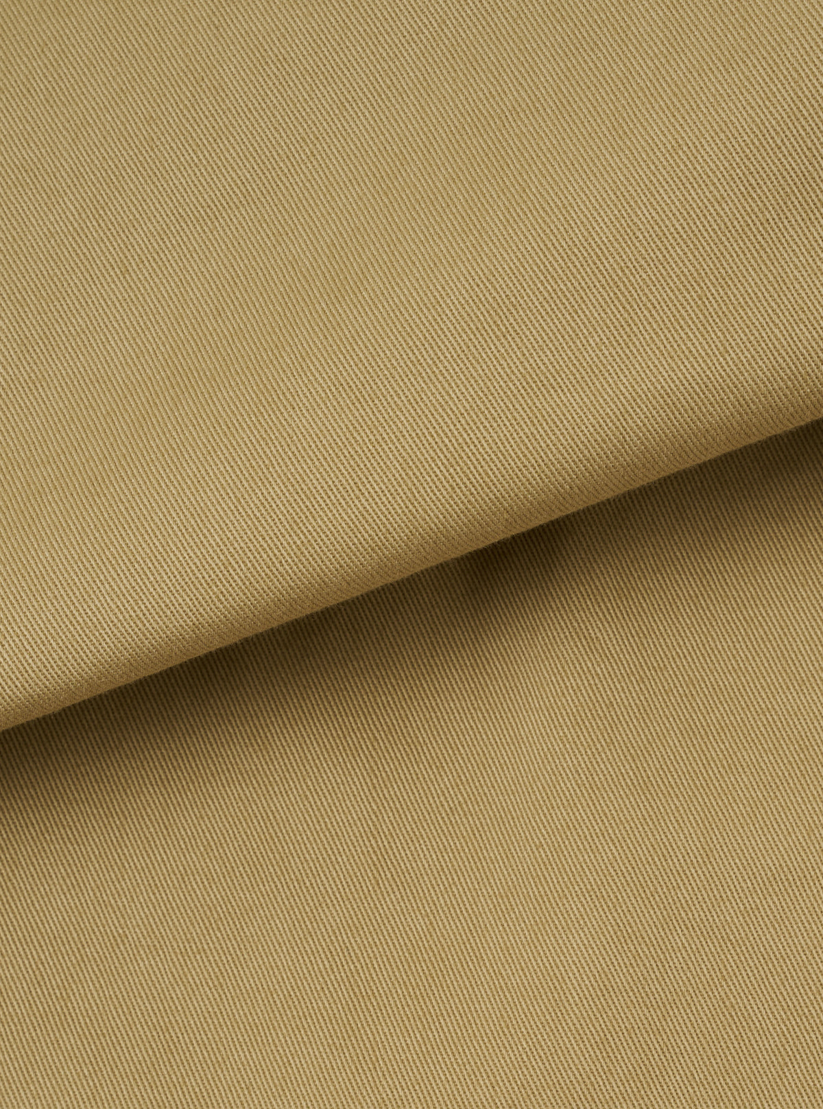 A close-up fabric swatch image of the Sand Twill Three Button Jacket set against a plain background. Displays the fine diagonal twill weave, subtle cotton texture, and light sand beige color.