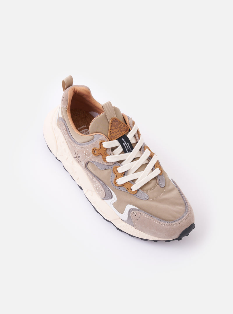 The Flower Mountain Light Brown Suede/Nylon Rulis Uni is shown from the rear three-quarter angle as a flat lay against a white background. The image highlights the light brown suede and technical nylon upper, the webbing back pull tab, and the notched edge rubber gum sole.
