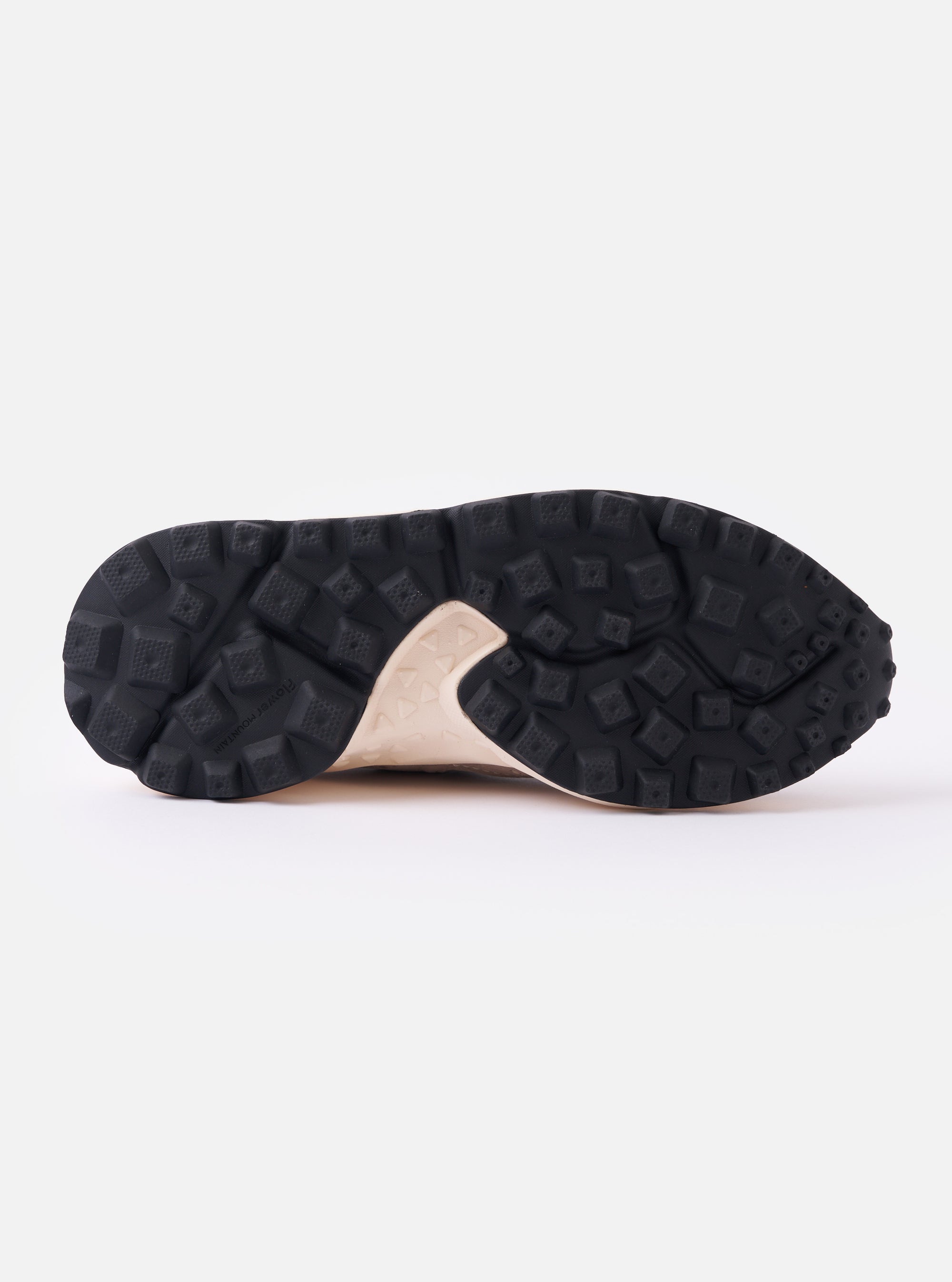 The Flower Mountain Light Brown Suede/Nylon Rulis Uni is shown from the rear in a studio shot against a plain white background. The image highlights the light brown suede heel counter, the brown technical mesh upper, and a black webbing pull tab. The off-white molded rubber sole features a textured, indented tread.