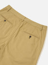 Detailed perspective view of the Sand Twill Military Chino on a crisp white backdrop. Emphasises the textured sand twill cotton material, tailored waistband seams, secure button fly, and clean entry design of the front side pocket.