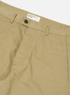 Close-up of the Sand Twill Curved Pant, showcasing the sand-colored twill fabric, curved design, button closure, and brand tag on a clean, white background.